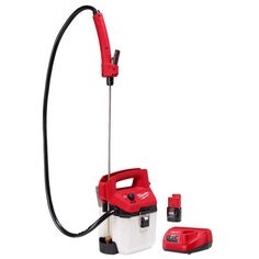 a red and white electric pressurer with two tools