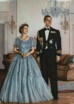 a man and woman in formal dress standing next to each other