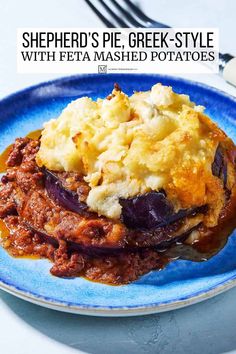 shepherd's pie greek - style with feta mashed potatoes on a blue plate