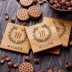 three personalized coasters with the names and date on them surrounded by chocolate chips