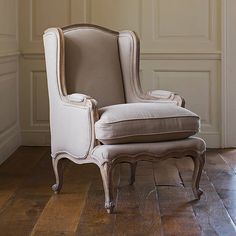 an old chair sitting in the corner of a room