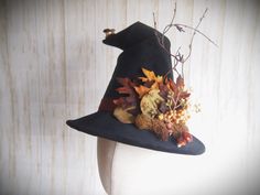 "SIZE: 20.5\"-21\" *For more styles, sizes, and designs, please visit our Website at:        www.EvercrumblyandWitch.com Black velveteen Witch Hat with rust band with fall foliage and little vintage mushrooms... even a couple perched on the crooked peak!    Brim is approx. 3\" (What we call our \"Demi\" brim!)    Handmade, one at a time by us in our studio, and individually sized for correct fit and comfort. Please select your size from the drop-down.   Carefully packed and shipped to you to ensure it arrives safely!      Makes a great gift!" Fantasy Crown, Black Witch Hat, Witch Shop, Hat Base, Vintage Witch, Vintage Mushroom, Halloween Hats, The Good Witch, Costume Hats