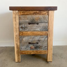 a wooden table with three drawers on it