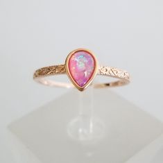 This Is A 7mmx5mm Teardrop Simulated Pink Opal Cabochon Set On Sterling Silver With 18k Rose Gold Over It. The Colors Inside Are Gorgeous And The Extra Detail On The Metal Work Gives It A More Upscale Look. Very Delicate And Elegant, See Pictures For Details. Pink Opal Rings, Spiritual Rocks, Opal Engagement Rings, Pink Opal Ring, Run The Jewels, Pretty Ear Piercings, Ring Inspo, Ph Level, Engagement Rings Opal