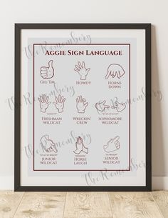 a sign language poster hanging on the wall