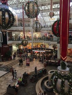 the inside of a shopping mall decorated for christmas