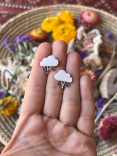 ☮️ Welcome to Summer Of Love Jewels ☮️ Listing is for (1) pair of Adorable Rain Cloud Stud Earrings 🌧 Measurements: Length: 18mm Width: 16mm Material: 18kt Gold Plated, Enamel Let me know if you have any questions. Teardrop Earrings As Gift, Cute Earrings With Dangling Charms For Gifts, White Earrings With Dangling Charms For Gift, White Drop Earrings Gift, White Drop Earrings For Gift, Cute Hypoallergenic Teardrop Earrings, Hypoallergenic Drop Earrings For Gift, Hypoallergenic Teardrop Plug Earrings Gift, White Teardrop Plug Earrings As Gift