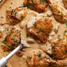 chicken with mushroom gravy in a skillet