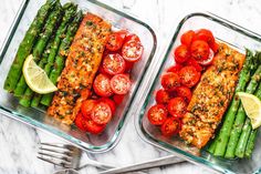 two glass dishes filled with salmon, asparagus and tomatoes