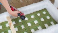 a person is using a tool to cut through the foam on top of a piece of wood