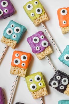 monster rice krispies treats on sticks with eyes and googly eyes in the middle