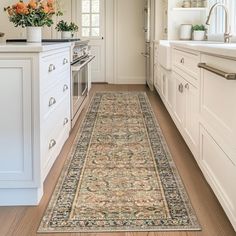 a large rug in the middle of a kitchen