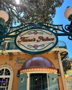 the entrance to an upscale restaurant called venus's palace with lights on and signage above it