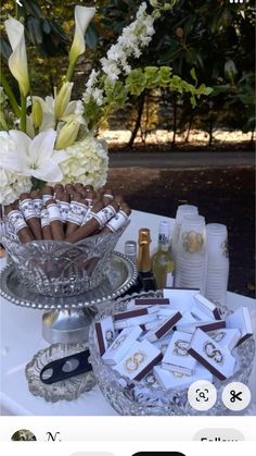 a table topped with lots of different types of food and wine bottles on top of it