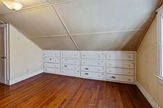 an empty room with lots of drawers in it