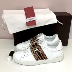 Brand New In Box Valentino Garavani Rockstud Untitled Sneaker In White Leather And Leopard Print Haircalf With Platinum-Finish Rockstuds Original Designer Box, Dust Bag, Extra Pair Of Shoelaces And Care Card Included. Signature Elegance With A Modern Aesthetic! Retail Price $890+ Tax= $950 Lace-Up Closure Lightly Padded Leather Insole Rubber Sole With Traction Made In Italy Valentino Garavani Sneakers, Valentino Sneakers, Valentino Logo, Fur Sneakers, Valentino Garavani Shoes, Leopard Shoes, Valentino Rockstud, Valentino Shoes, Red Sneakers