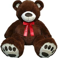 a brown teddy bear with a red ribbon around its neck