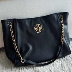 Only Wore It Once. For An Event. Doesn't Have Tags Or Original Packaging. Style: Tory Burch Britten Mini Tote Bag Material: Pebbled Leather Features : Adjustable Shoulderor Crossbody Strap, Center Zip Compartment, Inner Slip Pocket, Chain Accented Straps, Double T Logo Design Included Measurements - 9.5"H X 11.6"W X 4.7"D. T Logo Design, Tory Burch Britten, Pocket Chain, T Logo, Mini Tote Bag, Tory Burch Bag, Mini Tote, Womens Tote Bags, New Shop