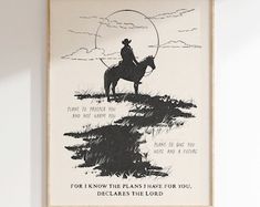 a framed poster with a cowboy riding a horse on the prairie saying, for know the plains have for you, decades the lord