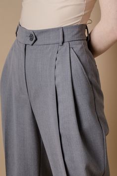 Pleated tapered bananas pants IPANTS in gray color combine high rise and comfortable loose cut. They fit perfectly different body shapes and heights and visualize our unusual vision on basic pants. With pleated bananas IPANTS You could easily and quickly create an incredibly comfy and stylish everyday city look. They are perfect with almost everything, cropped t-shirt to the blouse, cardigans, flat shoes, sneakers or heels you'll find them so easy to wear. * Two side and back pockets * Zip and b Classic Baggy High-waist Bottoms, Tailored Wide Leg Gray Pants, Tailored Gray Wide Leg Pants, Gray High-waisted Work Pants, Gray High-waisted Pants For Work, Tailored Gray Straight Pants Bottoms, Gray Tailored Straight Pants Bottoms, Tailored Gray Tapered Leg Bottoms, Gray High Waist Bottoms With Belt Loops