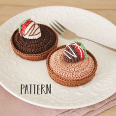 two crocheted pastries on a white plate