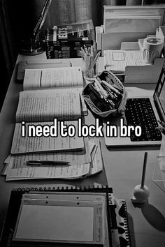 a desk with books, laptop and papers on it that says i need to lock in bro