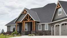 a large house with two garages on the front and one attached to the side