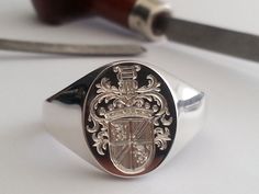 The extra detail hand engraved "Full coat of arms" Always a challenge  for our  "Master Hand Engraver"  one of the finest hand engravers in the world. We will guarantee you perfection and  a complete work of art. Extra heavy shank fully hallmarked in the London Assay office and available in the classic Oxford oval or Cushion shape head.                                                "Every cut is a Masterpiece" Family Signet Ring, Family Crest Rings, Signet Rings, Ring Hand, Gold Signet Ring, Classy Jewelry, Pinky Ring, Engraved Rings, The Master