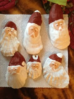 santa clause cookies are sitting on a napkin