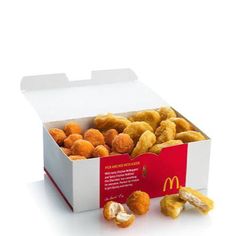 an open mcdonald's box filled with chicken nuggies