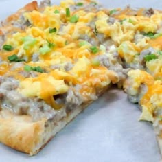 a pizza with cheese and other toppings on it