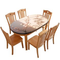 a dining table with six chairs and a flower design on the top, against a white background