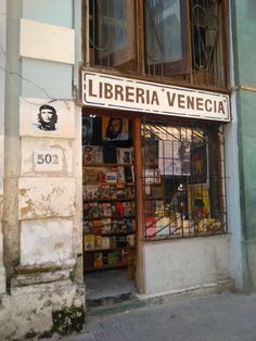 an old building with a sign that reads liberia venecia