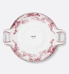 a red and white plate with handles on the side, in front of a white background