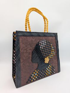 Stand out with our Handmade African Print Tote Bag! This striking Ankara handbag with the silhouette of a beautiful African queen combines tradition with modern style. It was handcrafted by skilled artisans in Ghana, West Africa, using authentic Ankara fabric. Perfect for the fashion-forward woman who values unique, high-quality craftsmanship. Detailed Product Description: * Handmade in Ghana by local artisans, from vibrant, durable Ankara fabric with a bold African print, and faux leather * Features sturdy handles and a spacious interior for all your daily essentials * Lightweight yet strong enough to carry heavier items * Designed with versatility for work, travel, or casual outings Usage and Benefits: * Everyday Use: A perfect tote for work, errands, or weekend getaways * Statement Acce Luxury Handwoven Bags For Gifts, Traditional Black Shoulder Bag As Gift, Traditional Black Shoulder Bag For Gift, Traditional Black Shoulder Bag Gift, Luxury Handmade Tote Box Bag, Handwoven Black Shoulder Bag As Gift, Handwoven Black Shoulder Bag For Gift, Handwoven Black Shoulder Bag Gift, Handmade Black Top Handle Satchel