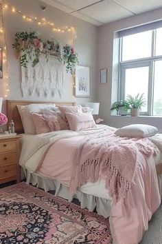 a bedroom decorated in pink and white with lights strung above the bed, rug on the floor