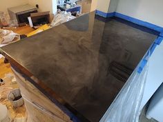 a kitchen counter is being constructed in preparation for painting