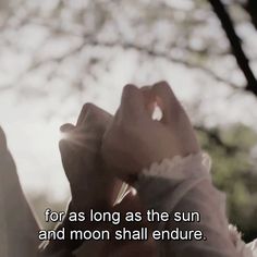 a person holding a cell phone to their ear with the caption for as long as the sun and moon shall endure