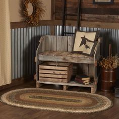 a wooden bench sitting on top of a hard wood floor next to a potted plant