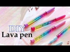 five different colored pens sitting on top of a white surface with the words diy lava pen