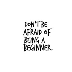 the words don't be afraid of being a beginner written in black ink