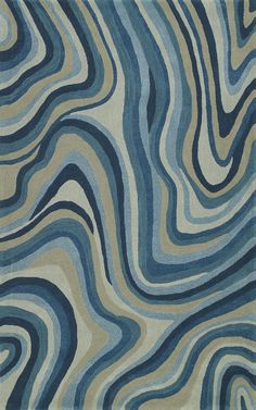 a blue and beige rug with wavy lines on it