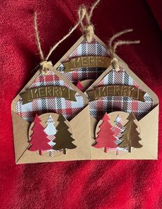 three christmas tree tags hanging from twine