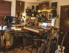 a room filled with musical instruments and guitars