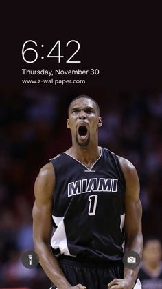 a basketball player with his mouth open in front of the camera and an iphone screen showing him