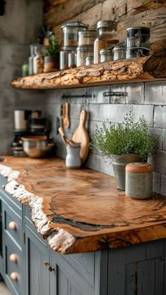 a kitchen counter with pots and pans on top of it, along with wooden shelves