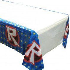 a table covered in blue and white cloth with red, white, and blue letters on it