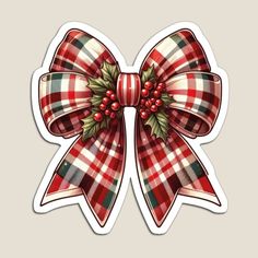 a red and white plaid bow with holly berries on it's side is shown