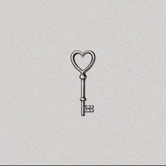 a drawing of a key with a heart on the end is shown in black and white