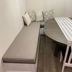 a bench and table in a small room